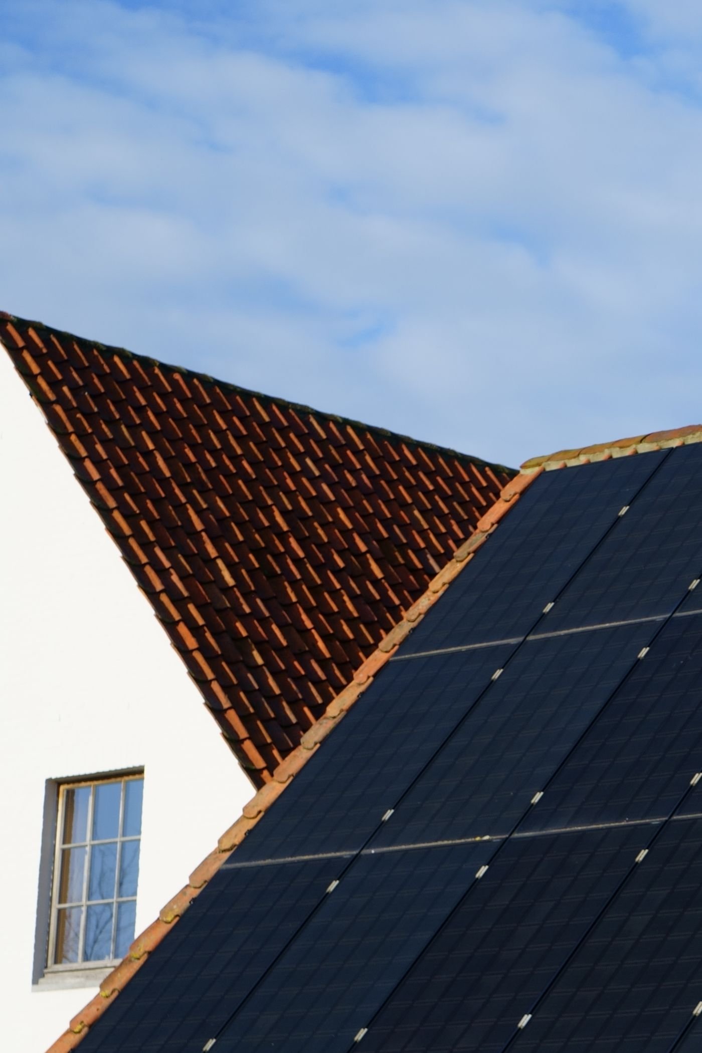 Solar modules mounted on a rail, the basis of a balcony solar mounting system