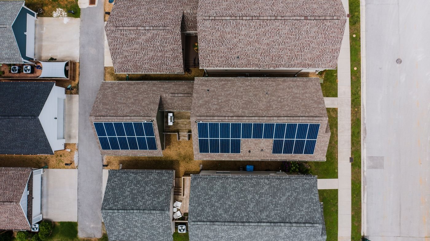 Rows of solar modules carried on a carport-style steel structure